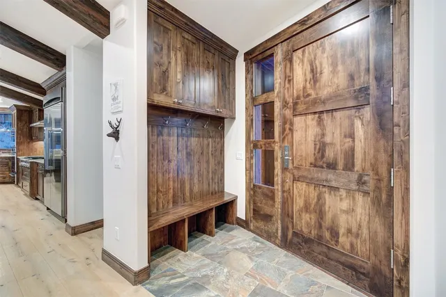 a view of an entryway with wooden floor