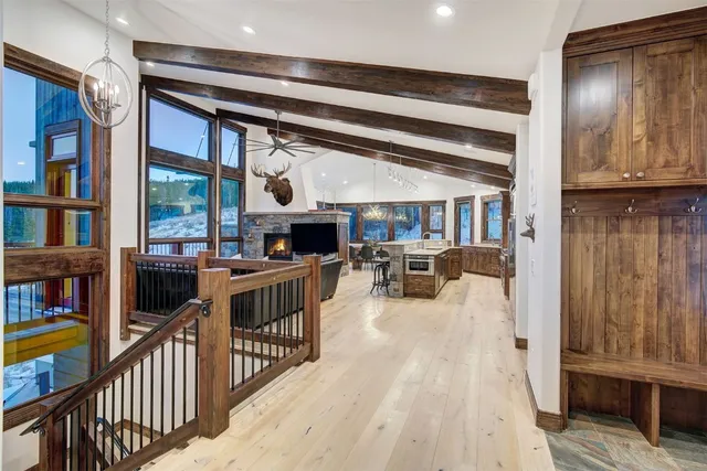a living room with furniture and a book shelf