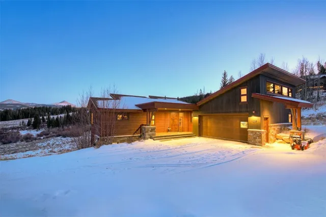 a view of a house with swimming pool and sitting area