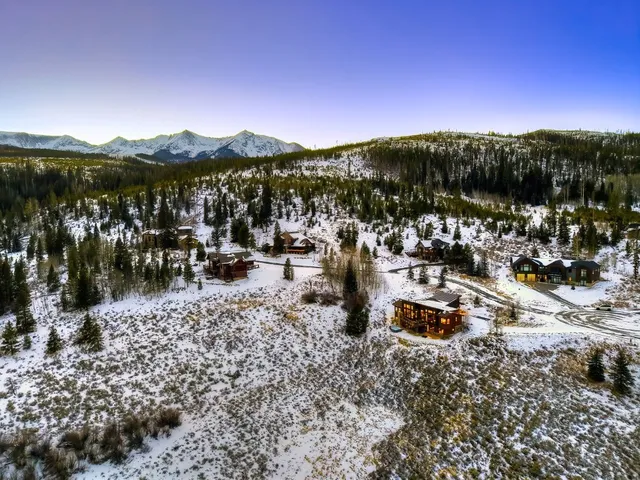 a view of a city with mountains in the background