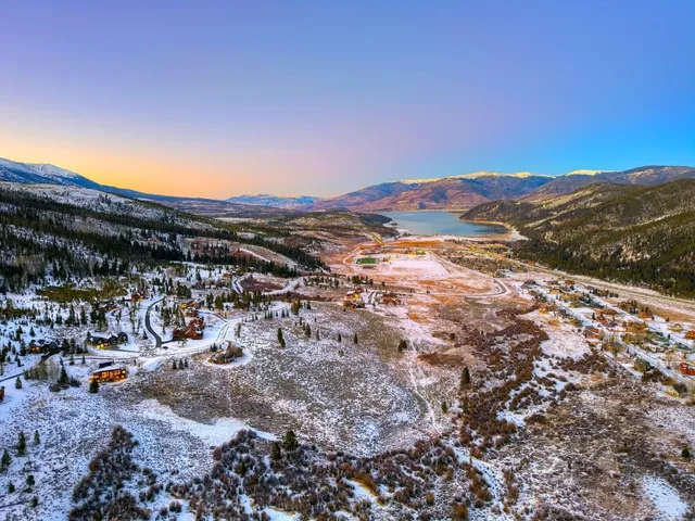 a view of a town with mountains in the background