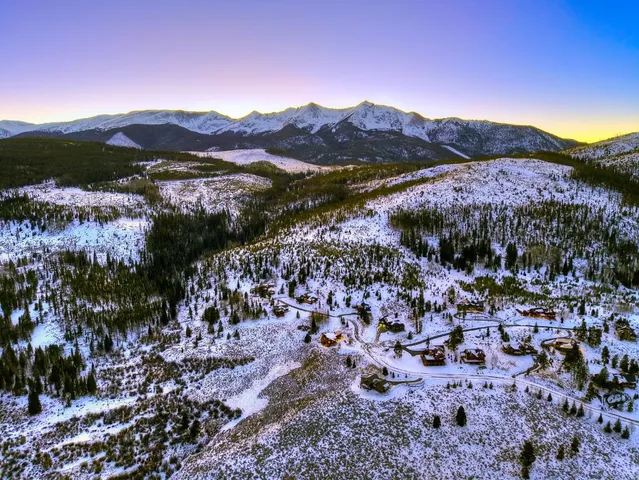 a view of a city with mountains in the background