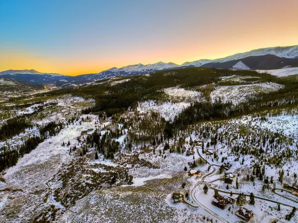 a view of outdoor space with mountain and city view