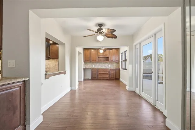a view of a hallway with a kitchen