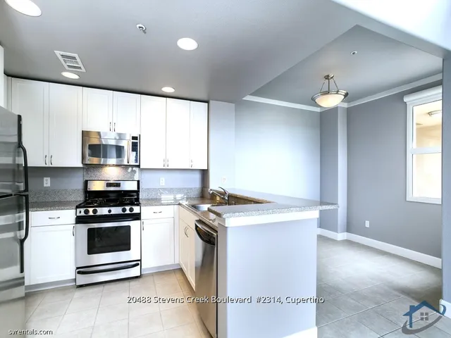 a kitchen with a stove and a microwave