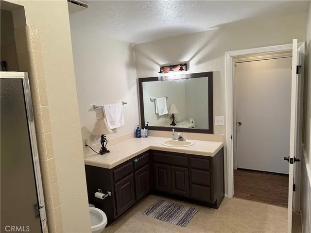 a bathroom with a double vanity sink and mirror