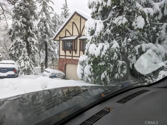a view of a house with a snow on the road