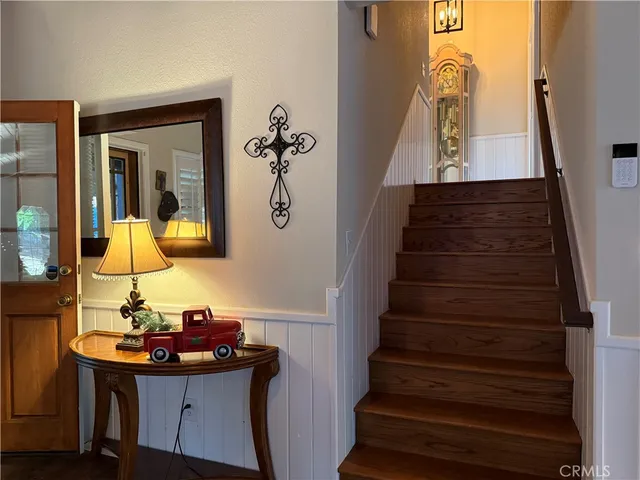 a view of entryway and hall with wooden floor