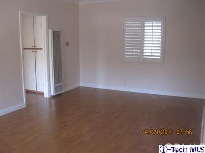 3010 Montrose, Unit 33 La Crescenta, CA 91214 - Photo 7 of 11 an empty room with wooden floor and windows