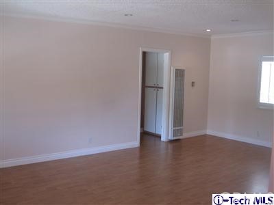 3010 Montrose, Unit 33 La Crescenta, CA 91214 - Photo 9 of 11 an empty room with wooden floor and windows