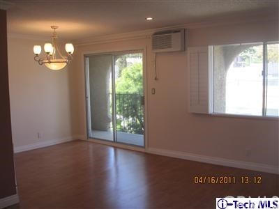 3010 Montrose, Unit 33 La Crescenta, CA 91214 - Photo 10 of 11 an empty room with wooden floor and windows