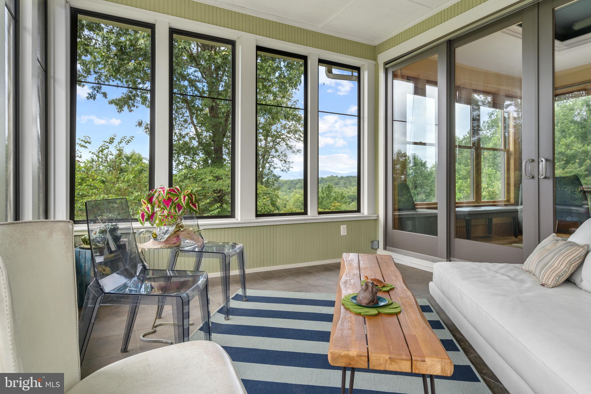 210 Grandview Road Washington, VA 22747 - Photo 17 of 62 a living room filled with furniture and a large window