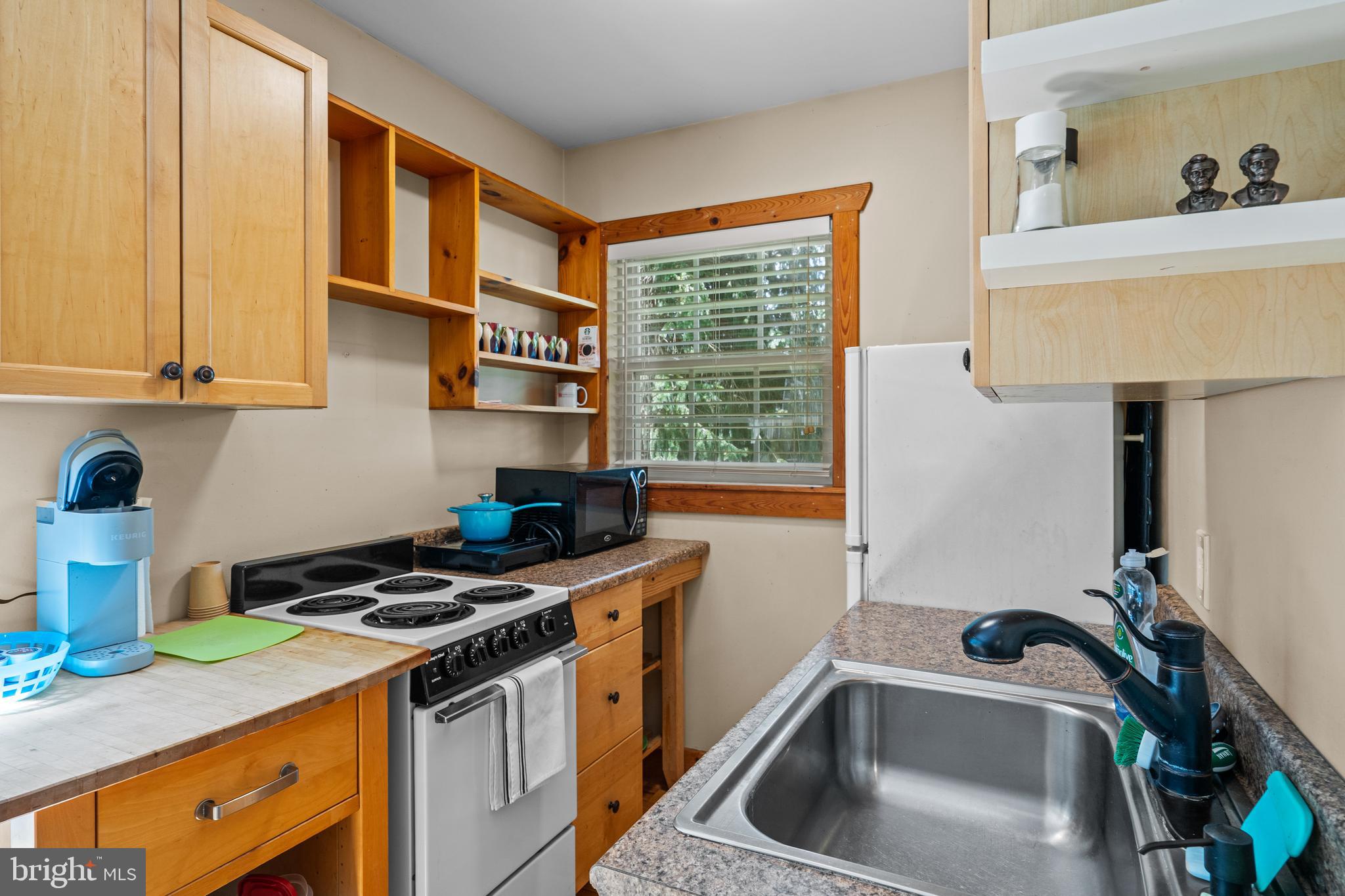 210 Grandview Road Washington, VA 22747 - Photo 42 of 62 a kitchen that has a sink and a stove