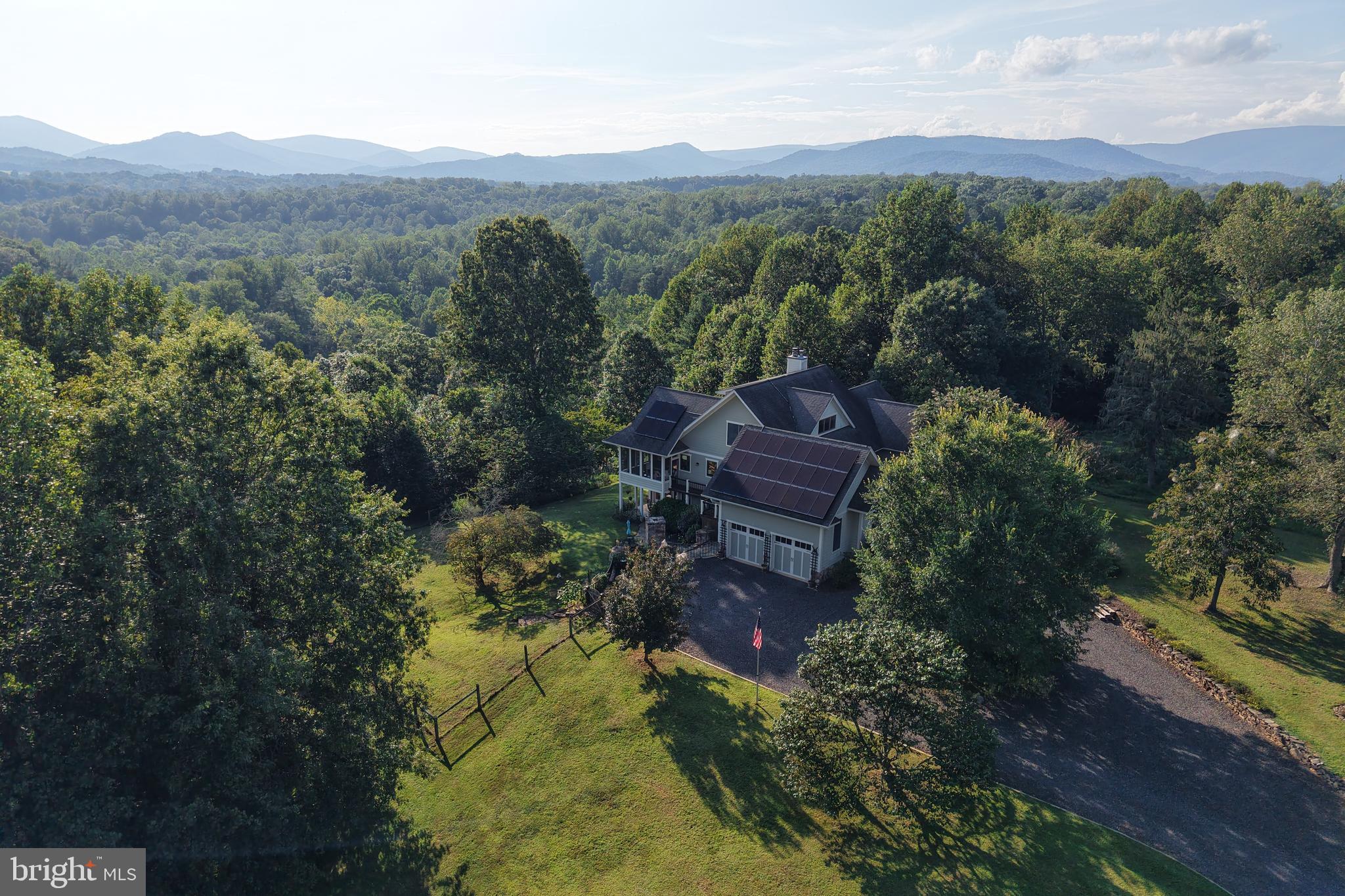 210 Grandview Road Washington, VA 22747 - Photo 60 of 62 a view of a lush green forest with mountains in the background
