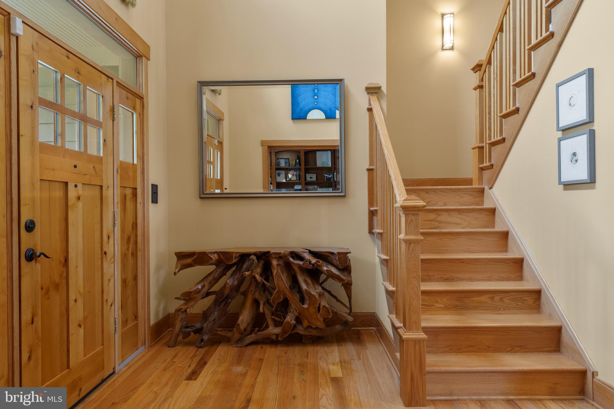 210 Grandview Road Washington, VA 22747 - Photo 9 of 62 a view of a livingroom with wooden floor and stairs
