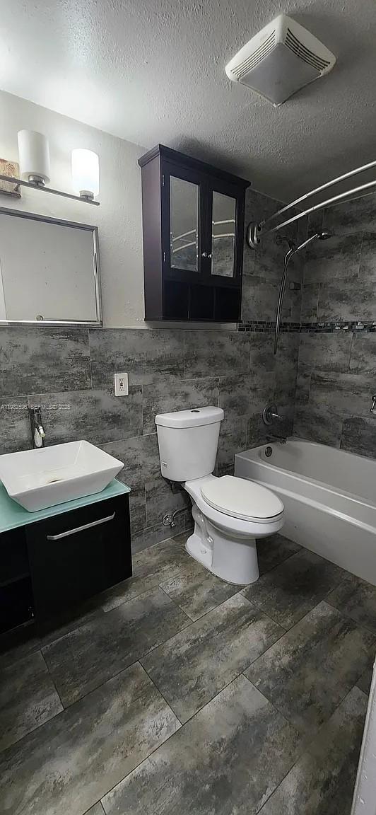 1 Northeast 78th Street, Unit B Miami, FL 33138 - Photo 4 of 8 a bathroom with a sink and a mirror