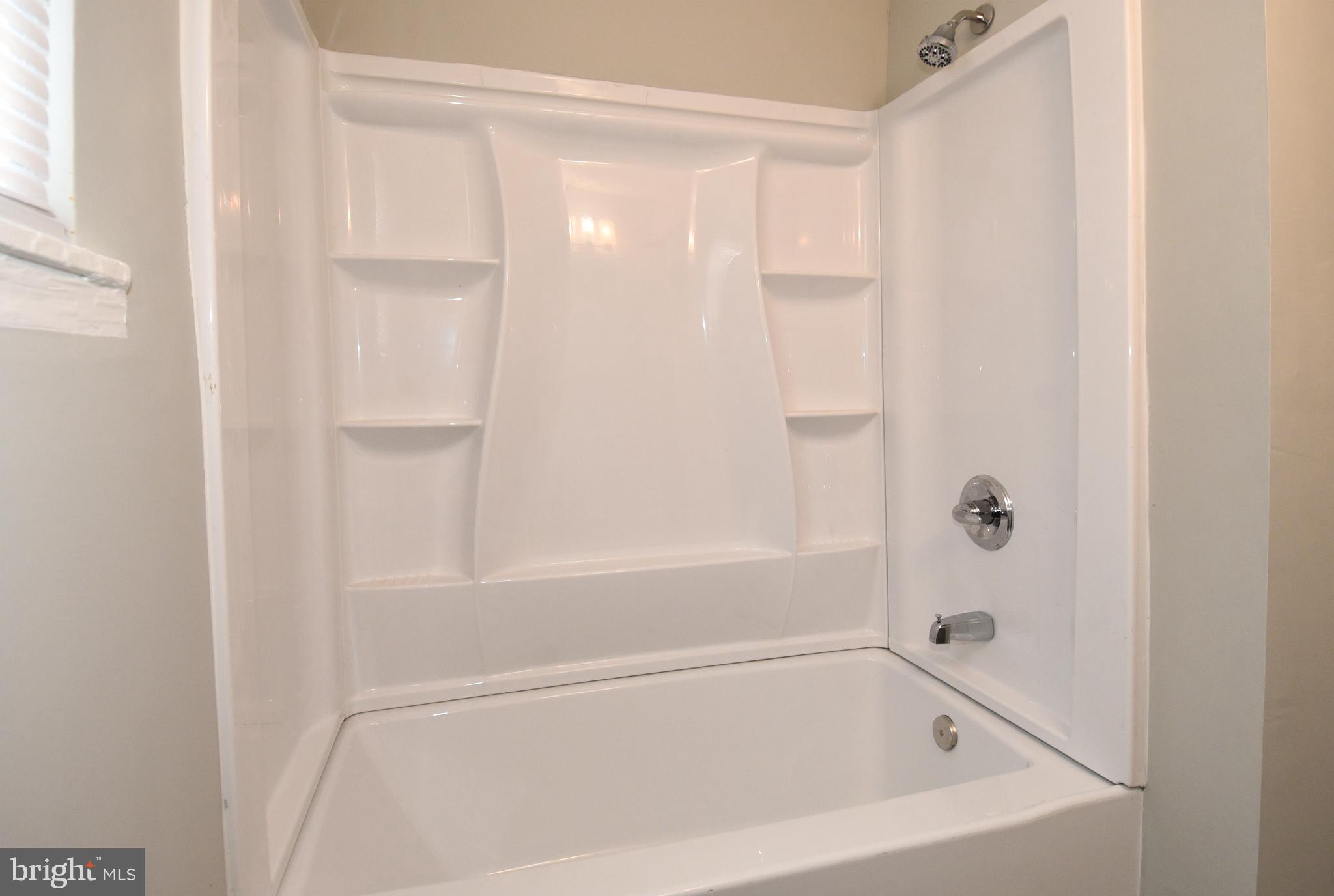 8208 Bellefonte Lane, Unit 5 Clinton, MD 20735 - Photo 15 of 17 Modern, sleek shower for a refreshing retreat.