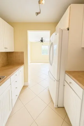 a bathroom with a sink a mirror and a shower