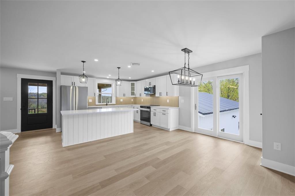 134 Kings Creek Road Georgetown, PA 15043 - Photo 11 of 44 a view of kitchen with granite countertop lots of counter top space and stainless steel appliances
