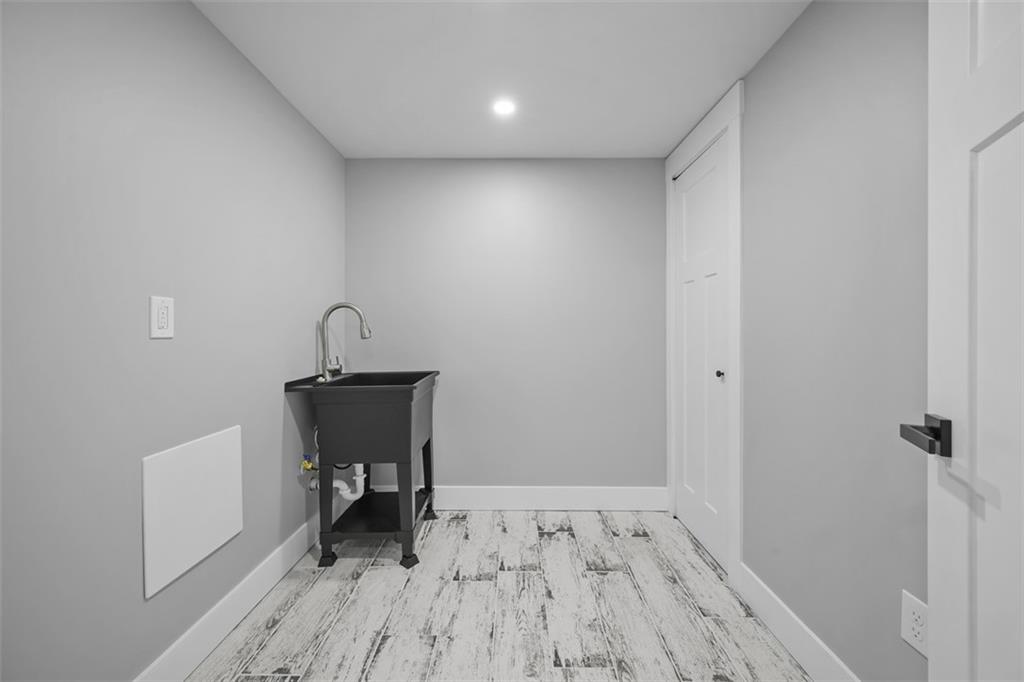 134 Kings Creek Road Georgetown, PA 15043 - Photo 32 of 44 a view of a room with wooden floor and bench