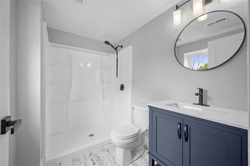 134 Kings Creek Road Georgetown, PA 15043 - Photo 35 of 44 a bathroom with a sink a toilet and a mirror