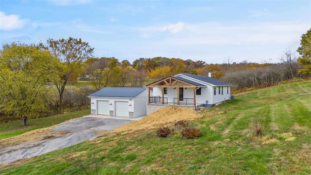134 Kings Creek Road Georgetown, PA 15043 - Photo 37 of 44 a view of a big house with a big yard and large trees