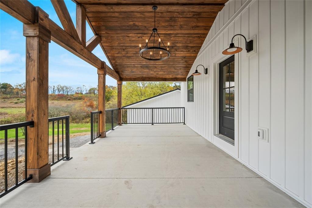 134 Kings Creek Road Georgetown, PA 15043 - Photo 5 of 44 a view of a porch with wooden floor and roof