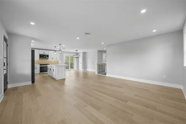a view of kitchen with wooden floor