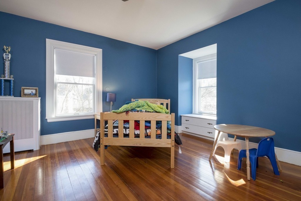 155 Eastbourne Road Newton, MA 02459 - Photo 17 of 25 a bedroom with a bed and wooden floor
