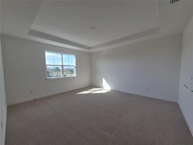 an empty room with a windows and closet