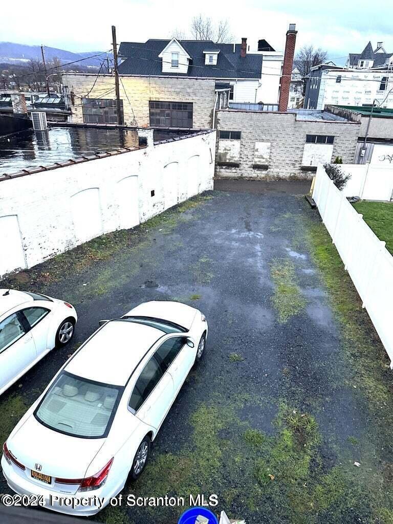 721 Columbia Street, Unit A Scranton, PA 18509 - Photo 11 of 12 a view of a backyard with table and chairs