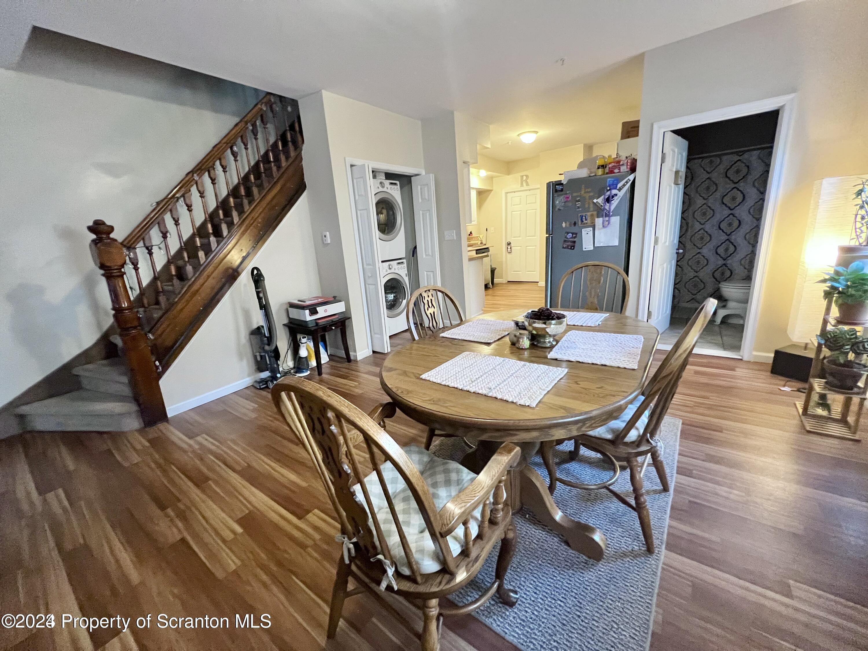 721 Columbia Street, Unit A Scranton, PA 18509 - Photo 2 of 12 a dining room with furniture and wooden floor