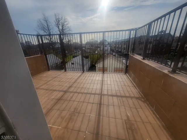 a view of balcony with wooden floor