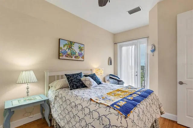 a bedroom with a bed and a lamp