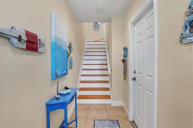 a view of entryway with stairs and wooden floor