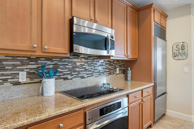 a kitchen with a sink and a stove top oven