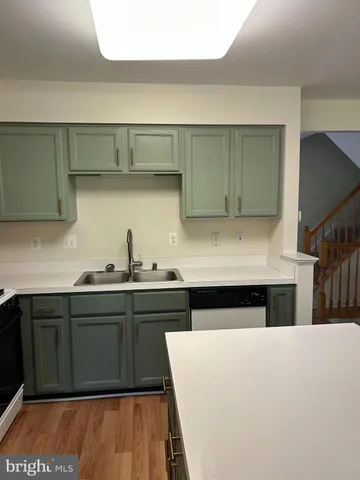 a kitchen with a sink and cabinets