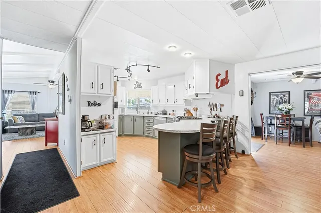a view of a dining room kitchen with furniture and wooden floor