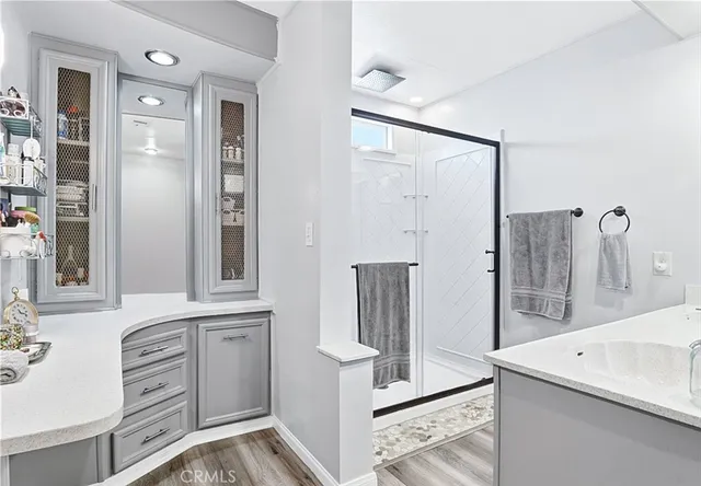 a kitchen with a refrigerator and a sink