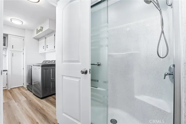 a bathroom with a bathtub and a shower