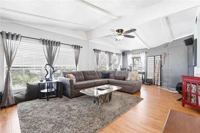 a living room with furniture and a large window