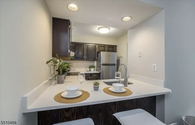 a kitchen with a table and chairs in it