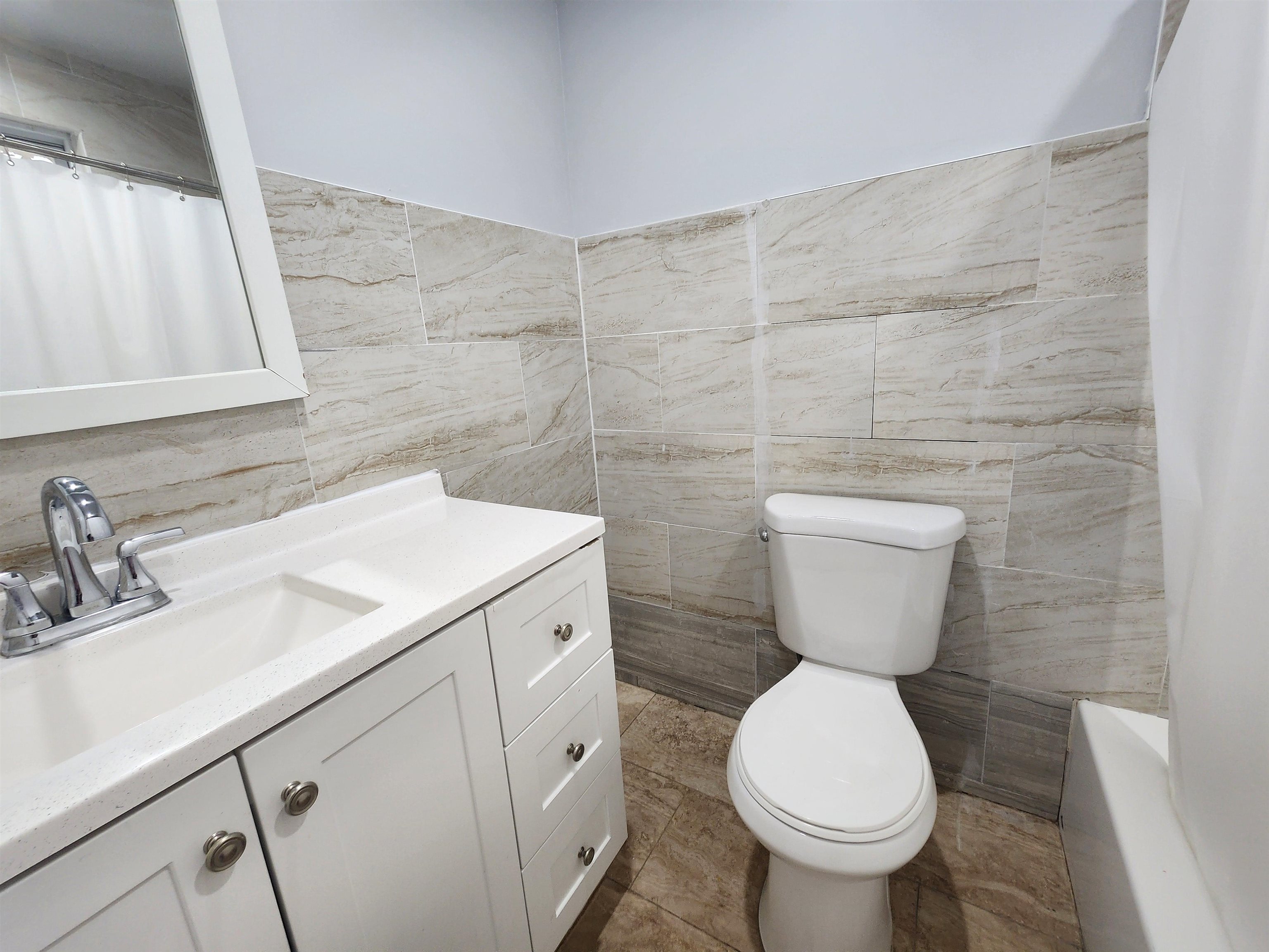 261 Centre Avenue, Unit 1 Secaucus, NJ 07094 - Photo 11 of 11 a bathroom with a toilet sink and mirror