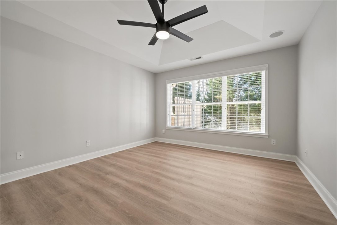 100 Shipyard Circle Anderson, SC 29621 - Photo 18 of 40 This spacious room features ample natural light, a ceiling fan, and beautiful flooring.