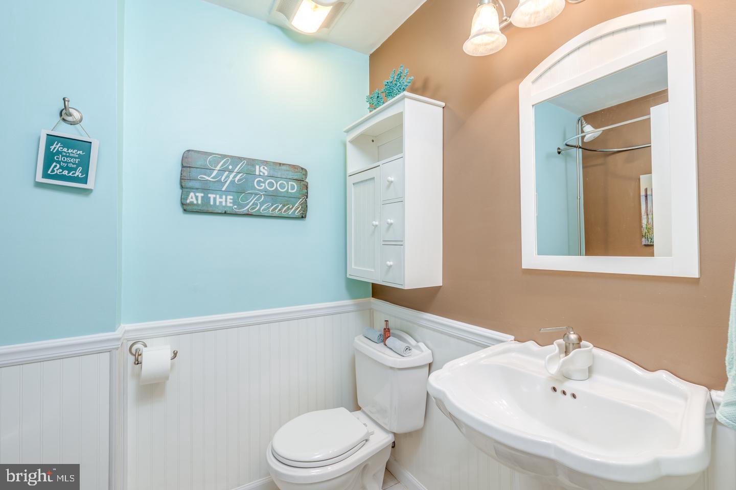 29 Sherri Way Pine Hill, NJ 08021 - Photo 12 of 28 a bathroom with a toilet a sink and mirror