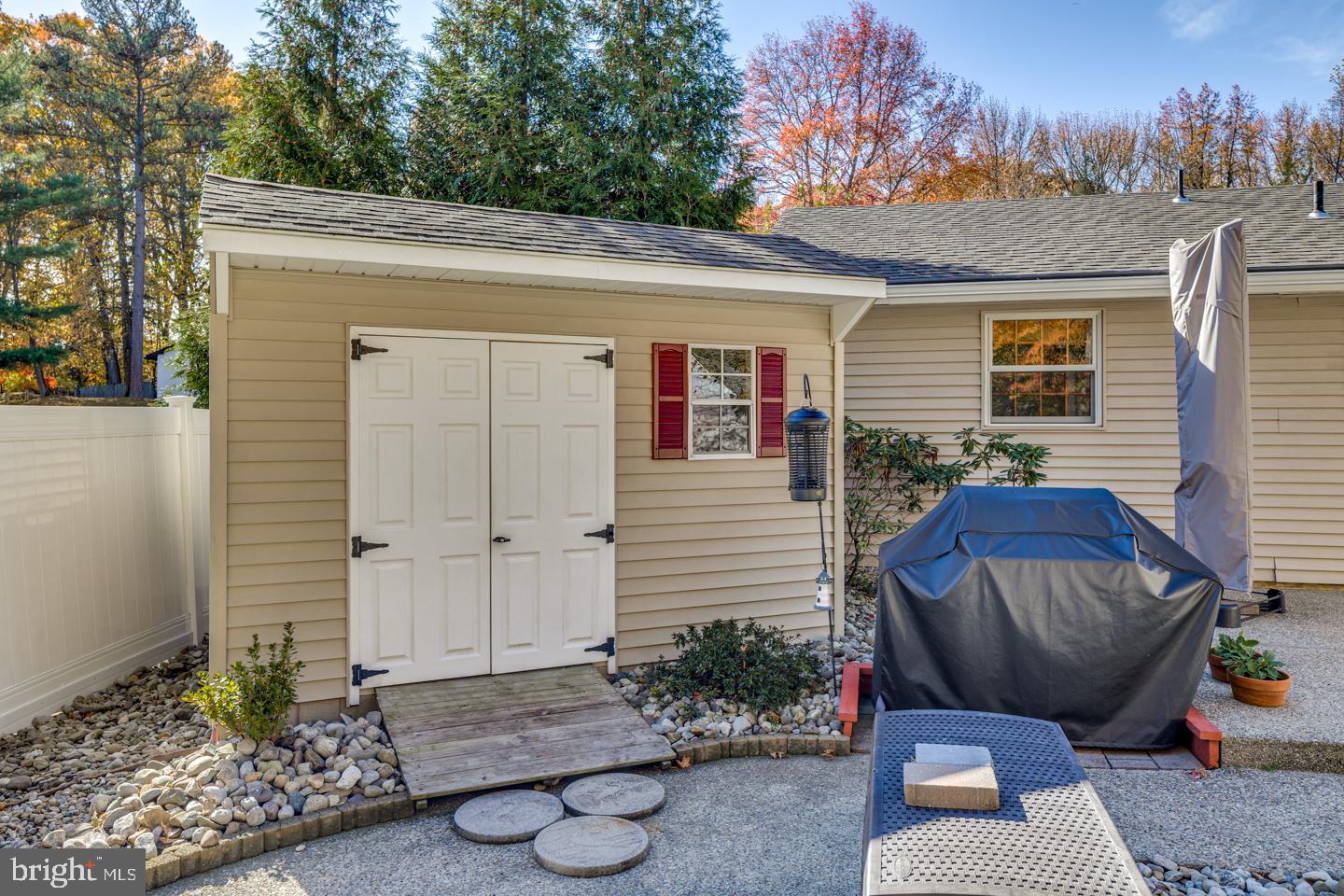 29 Sherri Way Pine Hill, NJ 08021 - Photo 24 of 28 a view of a chair and table in backyard of the house