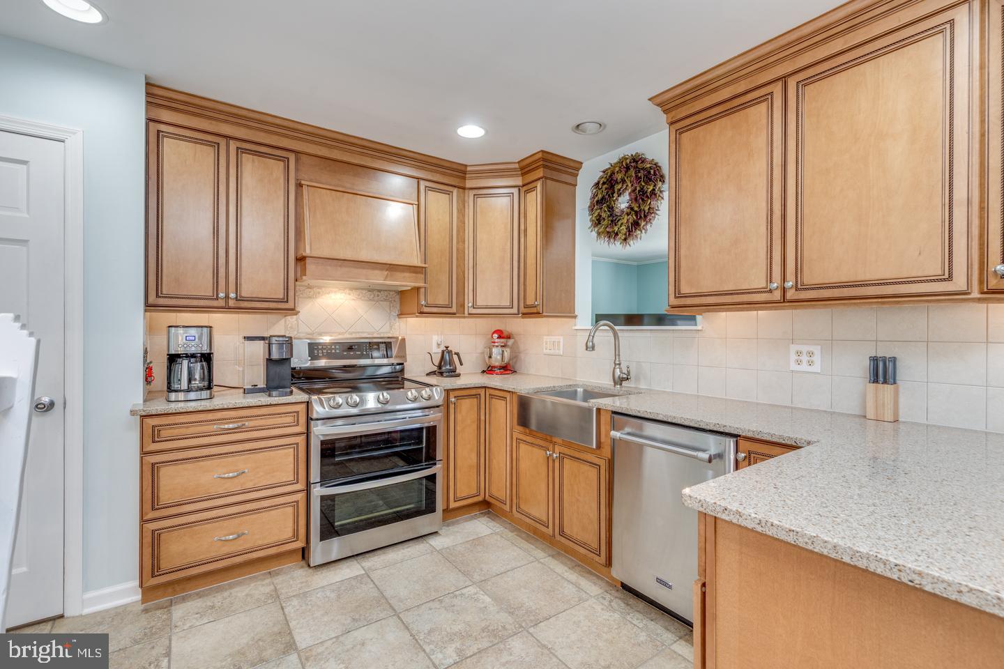 29 Sherri Way Pine Hill, NJ 08021 - Photo 9 of 28 a kitchen with stainless steel appliances granite countertop a sink and cabinets with wooden floor