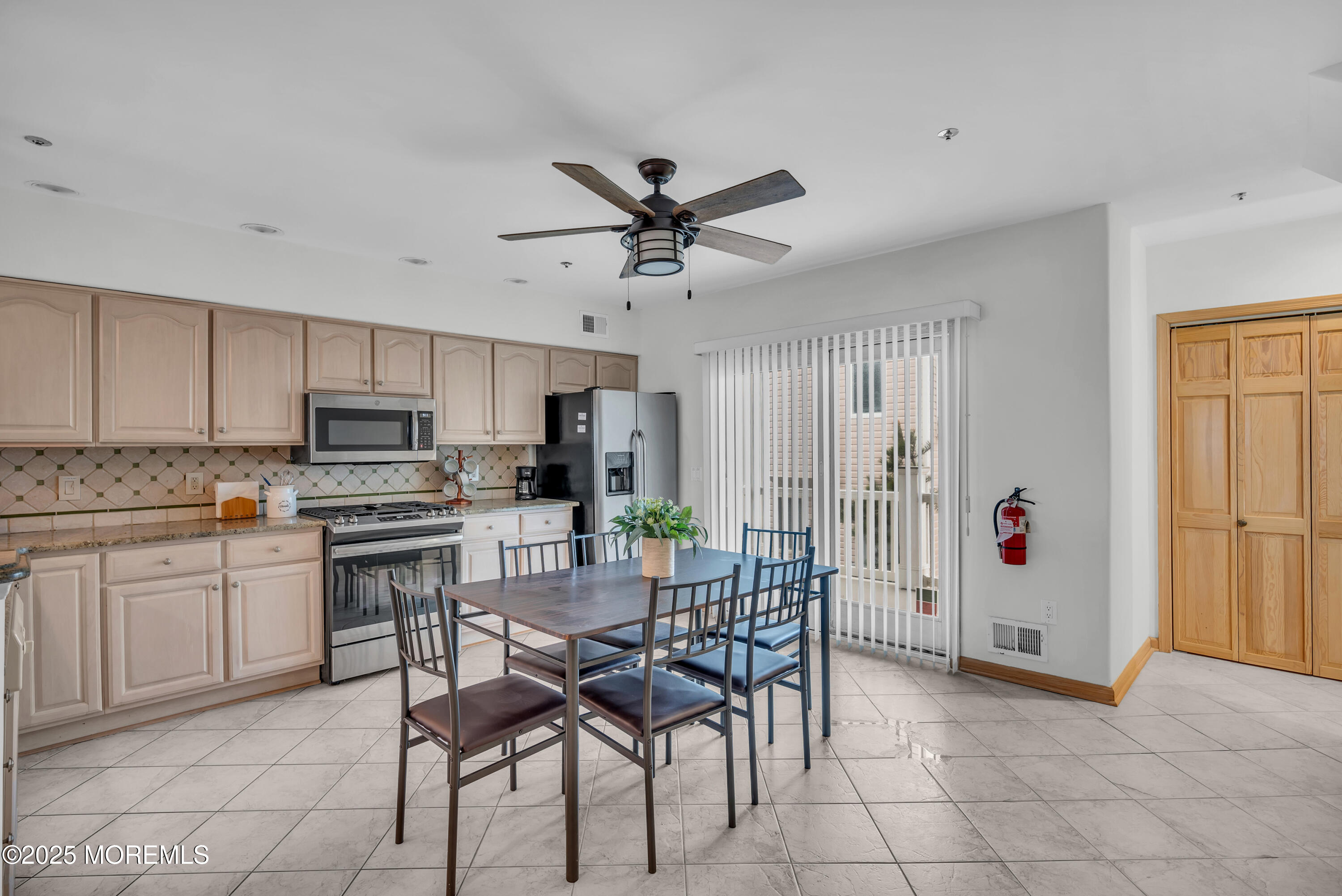 15 East Tuna Way, Unit B Lavallette, NJ 08735 - Photo 14 of 33 a kitchen with stainless steel appliances a stove a sink island and a refrigerator