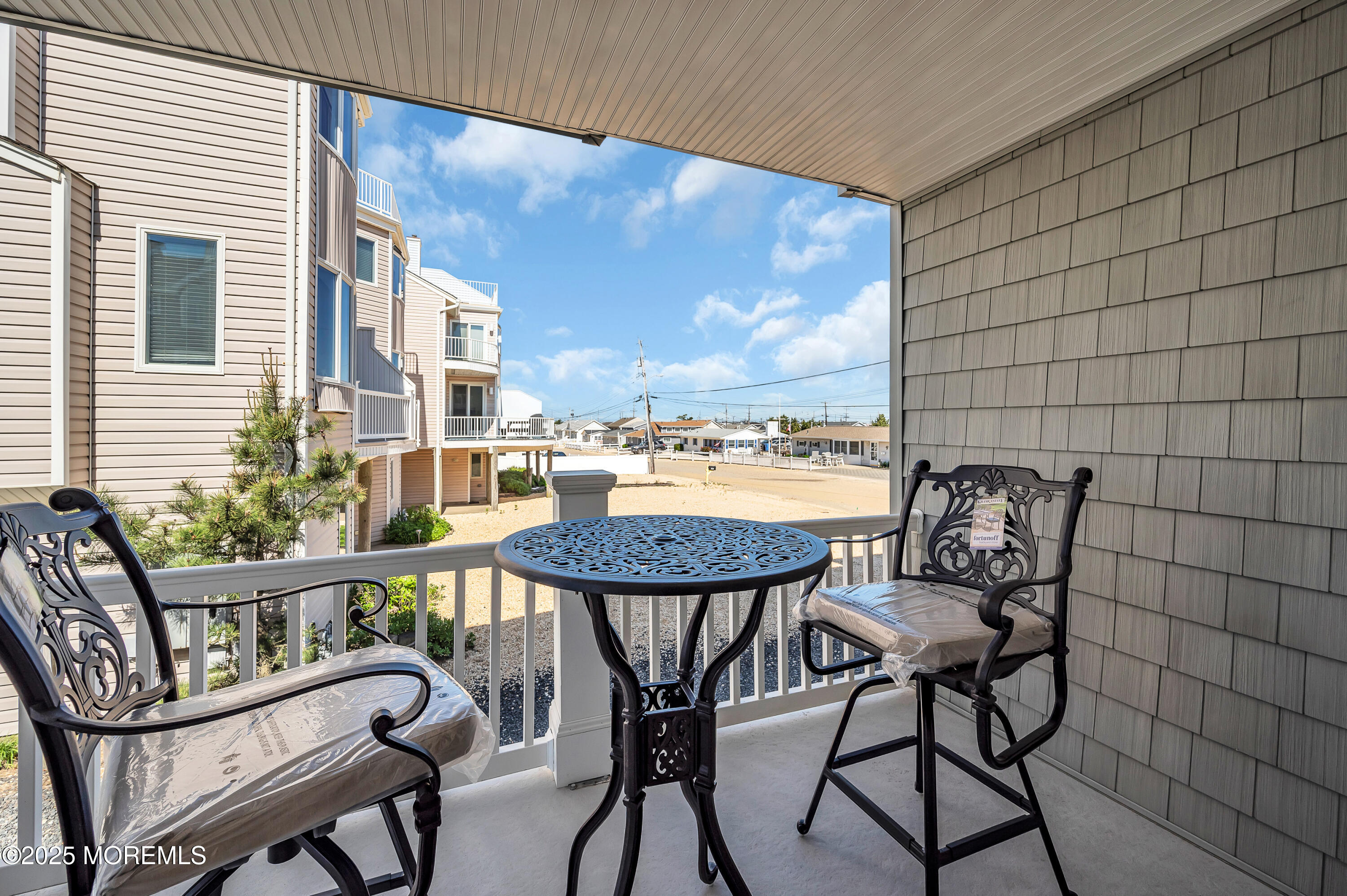 15 East Tuna Way, Unit B Lavallette, NJ 08735 - Photo 15 of 33 a view of a balcony with furniture and outside view