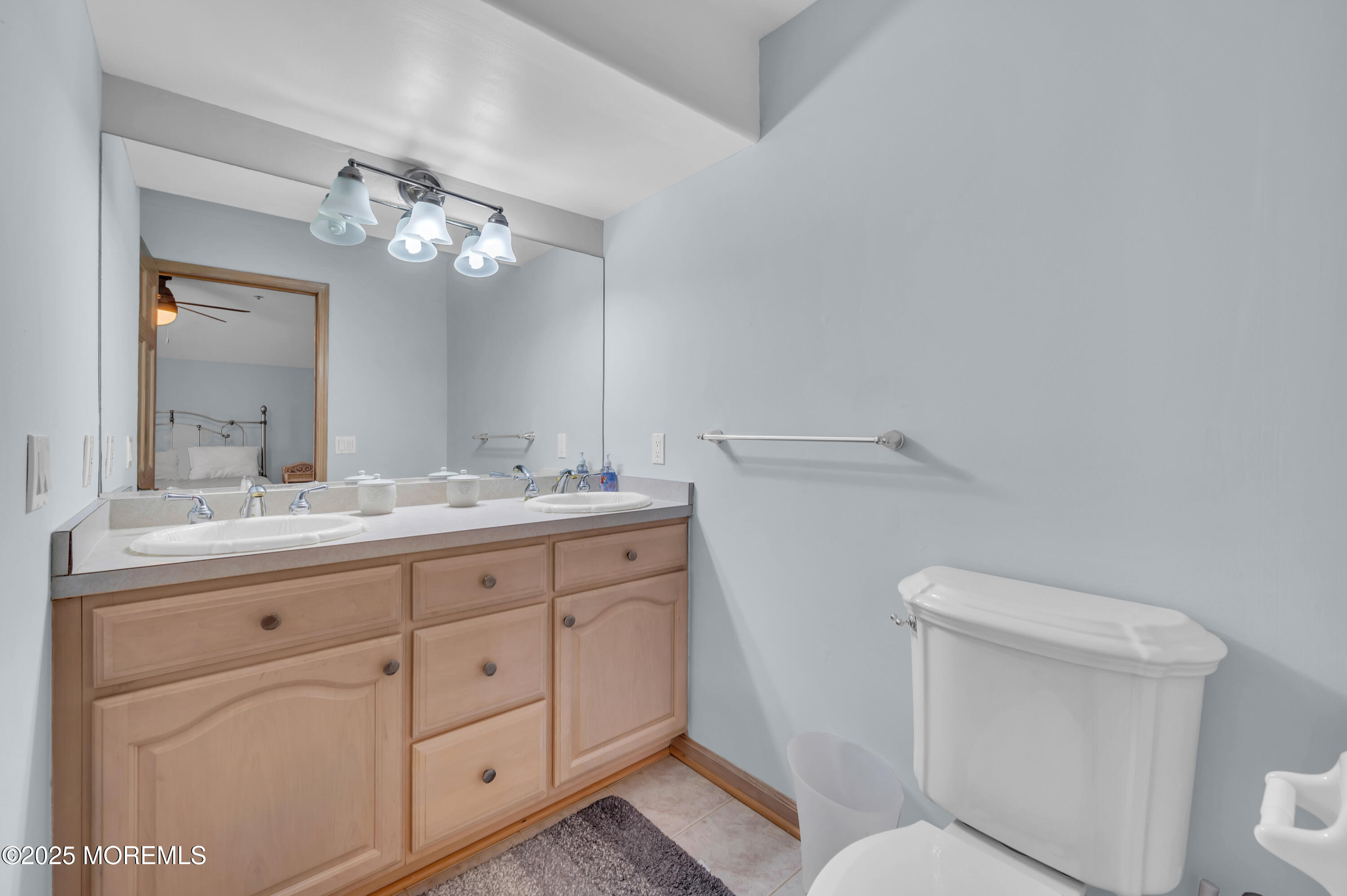 15 East Tuna Way, Unit B Lavallette, NJ 08735 - Photo 21 of 33 a bathroom with a granite countertop toilet sink and mirror